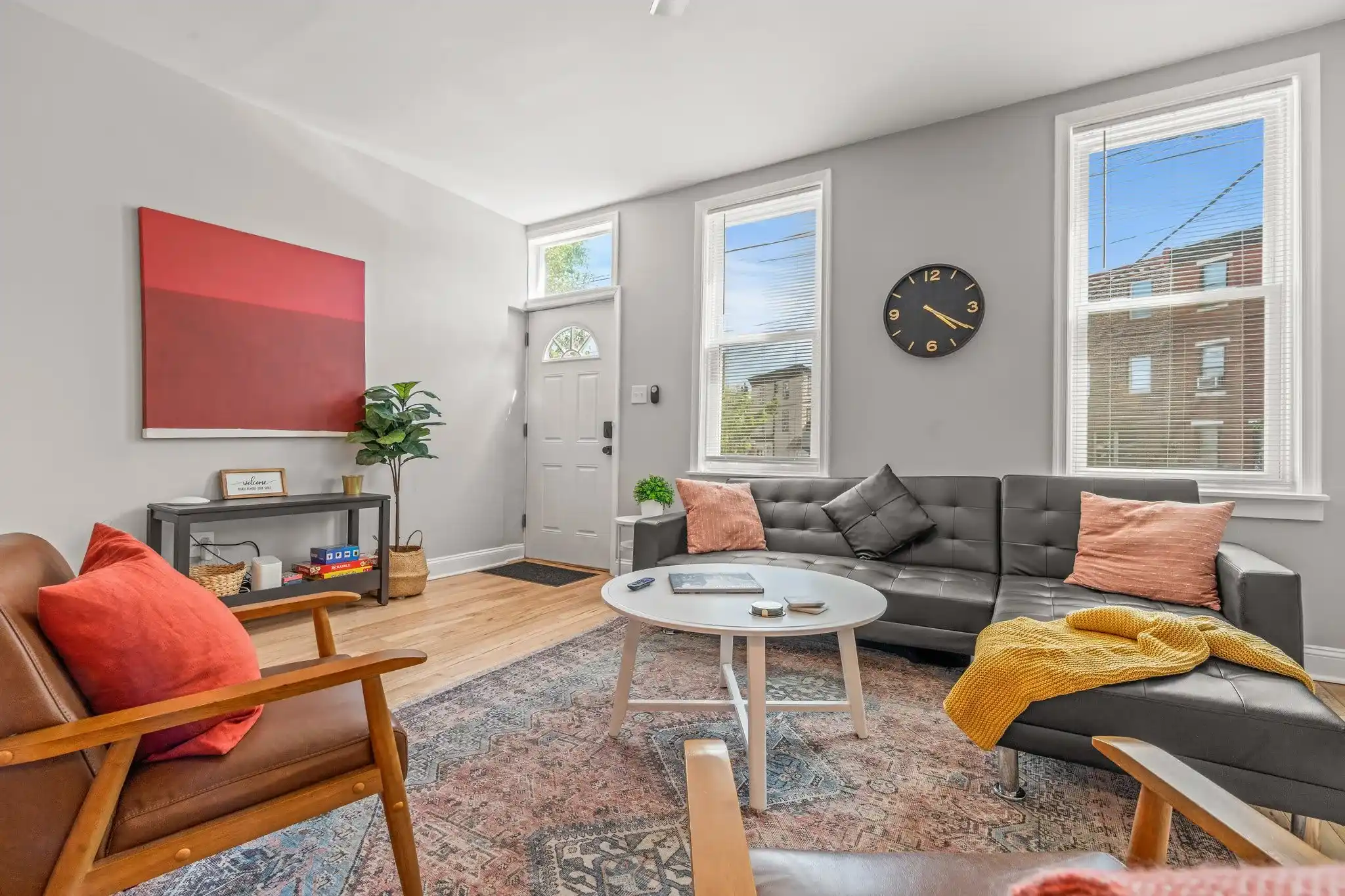 Flooded with natural light, this living area combines modern comfort with historic charm for the perfect place to gather and relax.