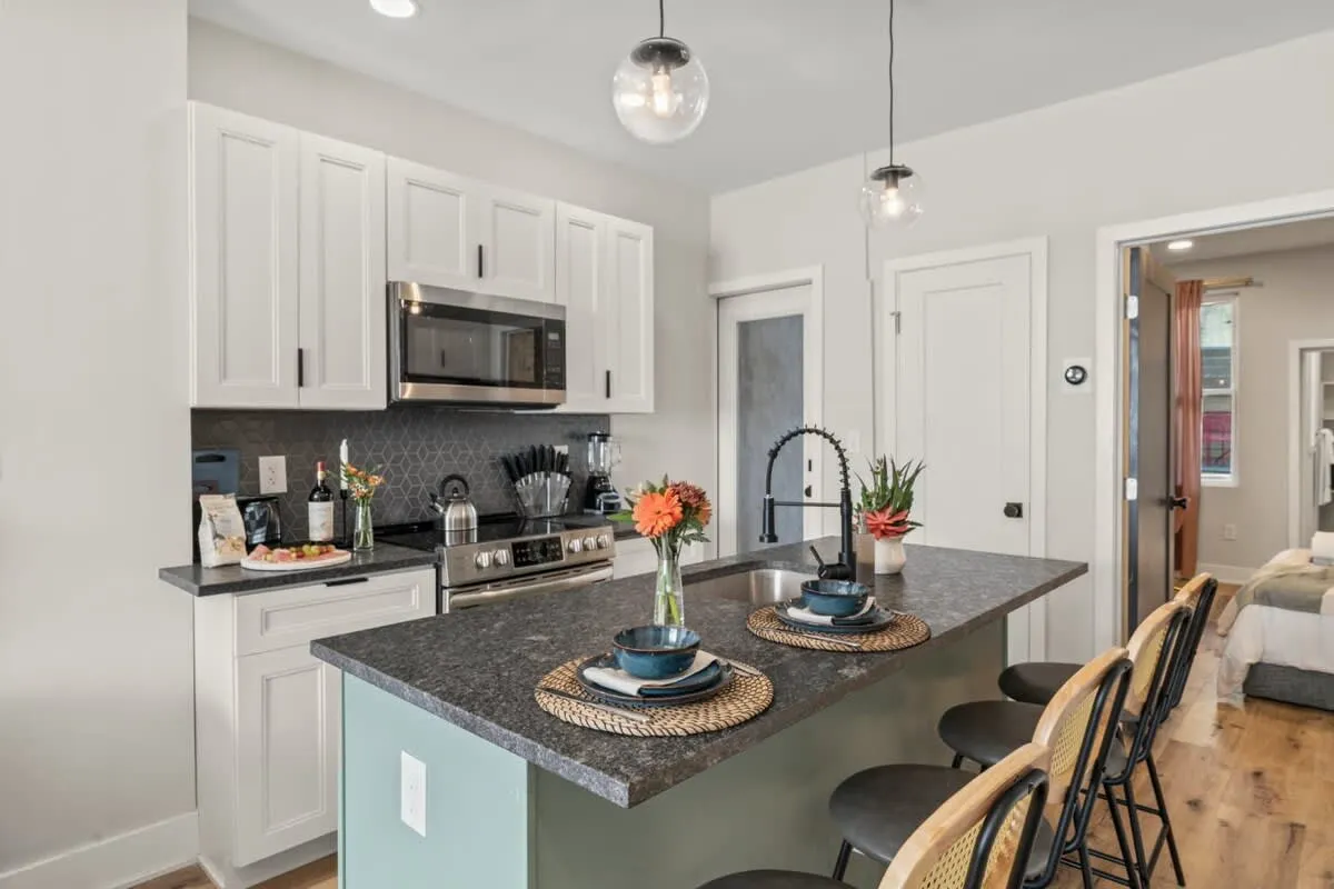 Gather around the island for coffee, wine, or casual bites—style meets function here.