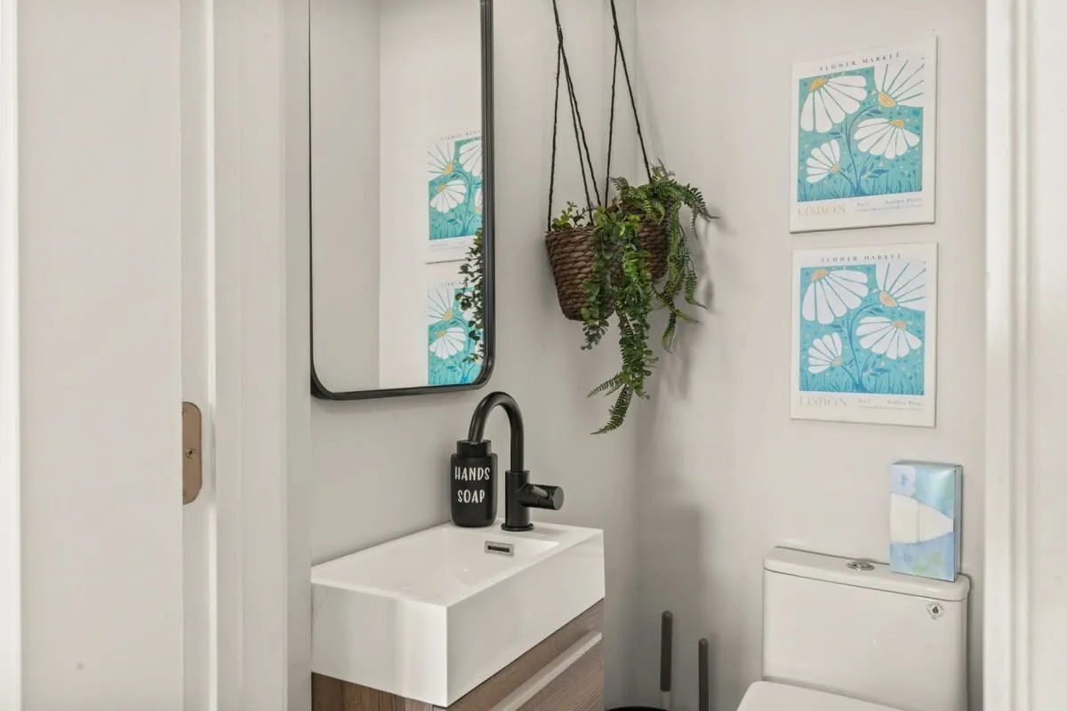 Fresh, stylish, and full of personality—this designer half bath brings boutique-hotel energy home.