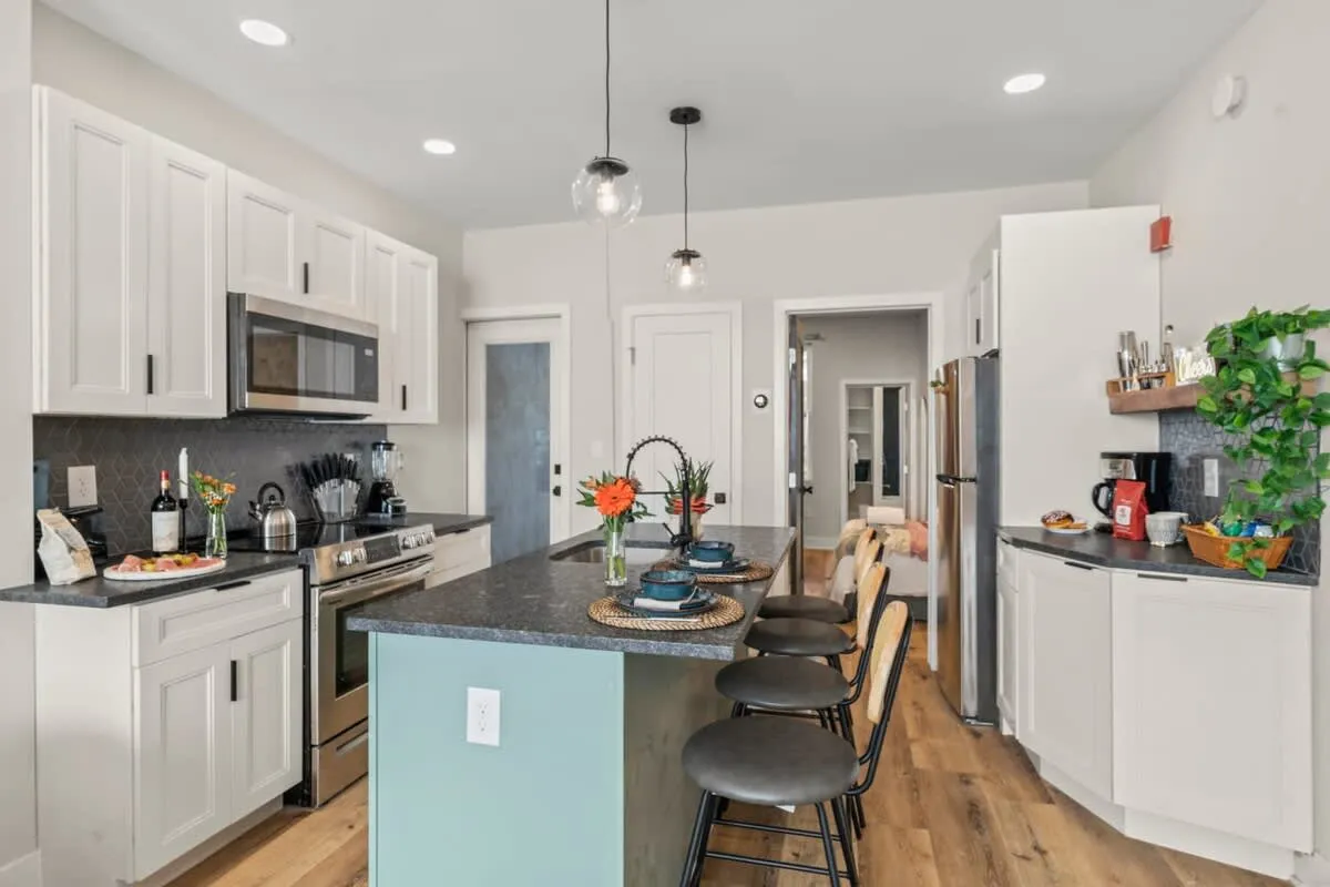 Cook, dine, and connect in this sleek, fully equipped kitchen with a modern city vibe.