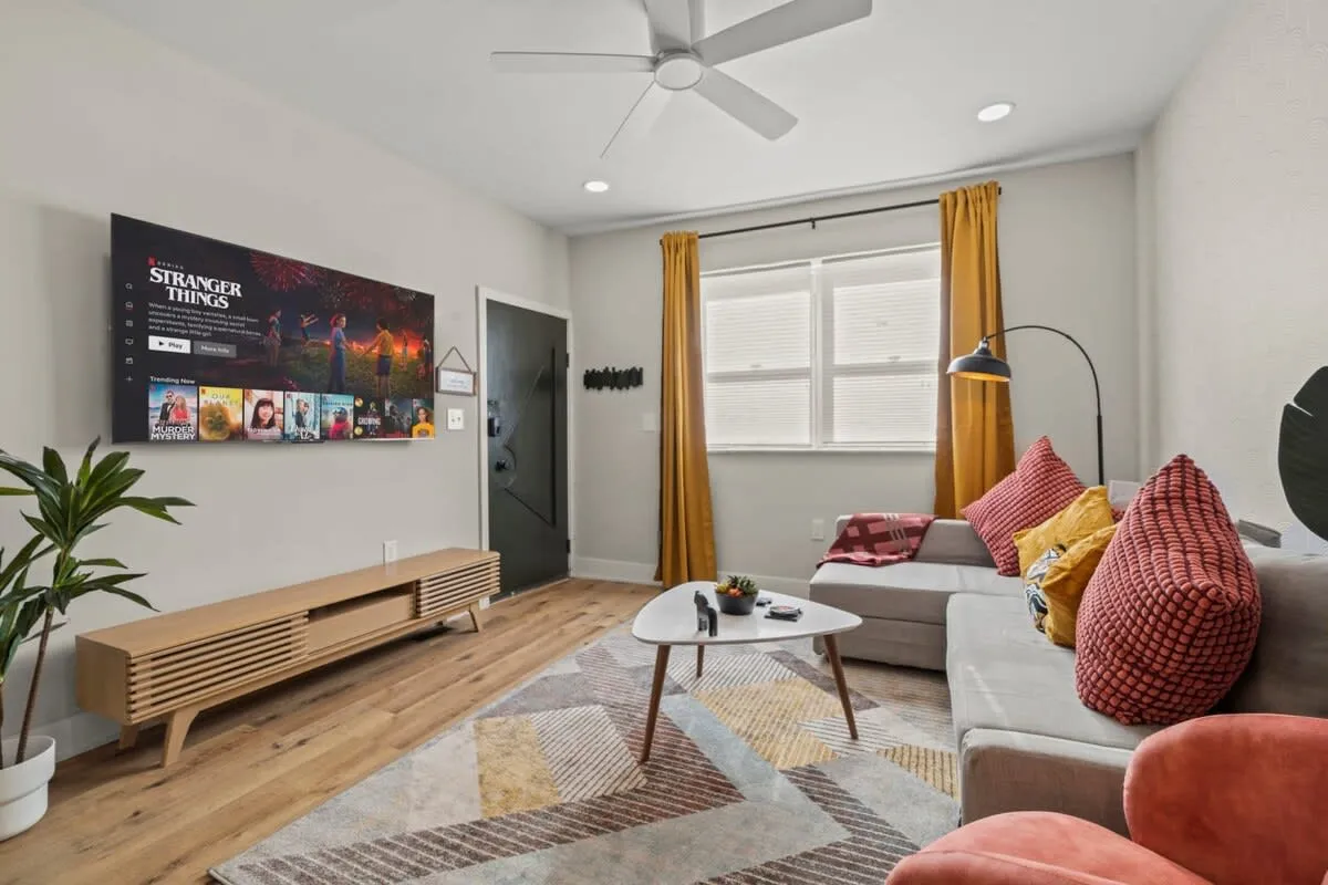 Movie nights just got cozy—stream your favorites and settle into your colorful city escape.