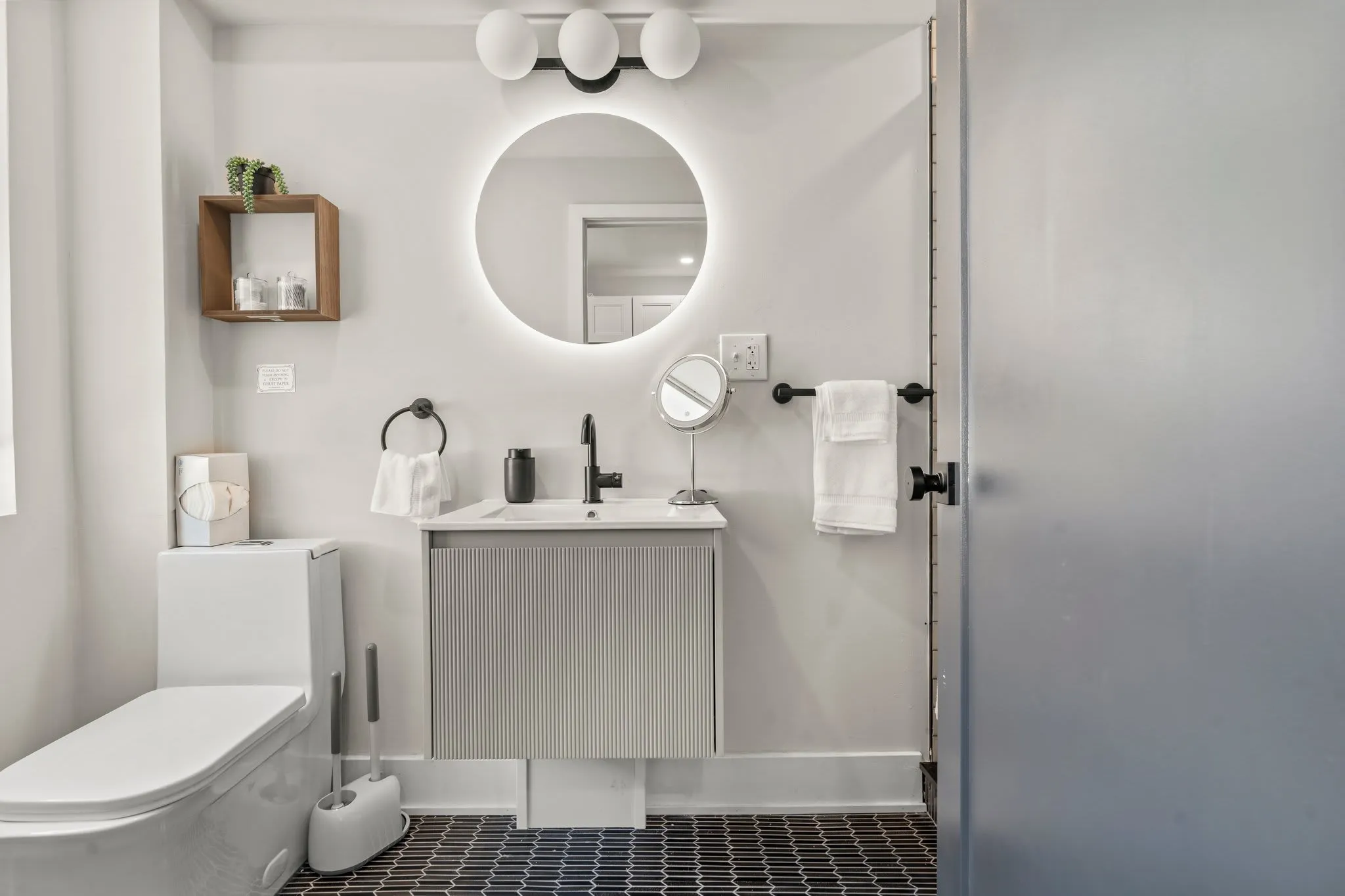 A spa-like bathroom with modern matte black fixtures and soft lighting for your morning routine.
