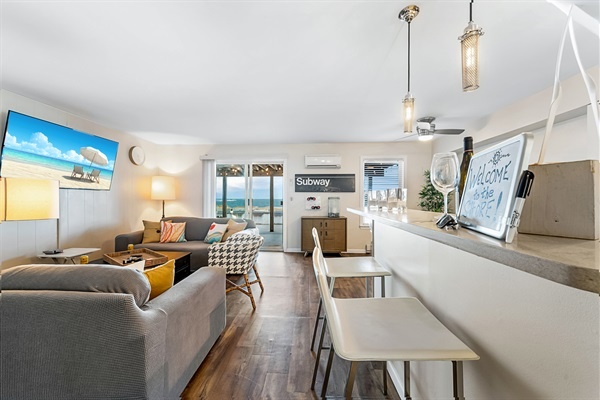 Settle in with a drink at the bar or unwind in the cozy lounge—your beach escape starts right here.