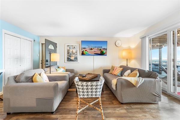 Gather, unwind, and take in the view—comfort meets the coast in this bright, airy living room.