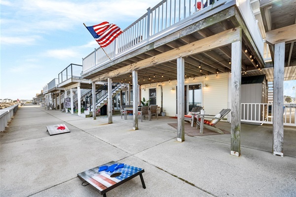 Step right outside and feel the ocean breeze—perfect for morning coffee, BBQs, or a round of cornhole by the sea.