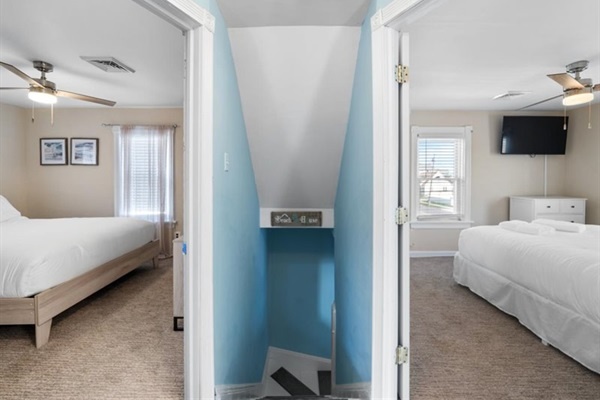 Two bright bedrooms upstairs with breezy beach tones—each a cozy retreat after sun-soaked days.
