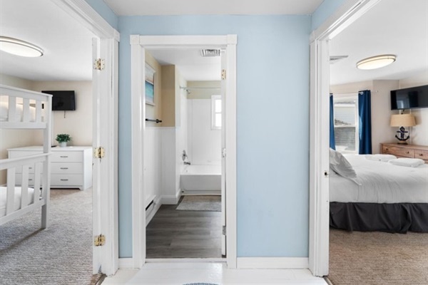 Bright and airy upstairs landing connecting cozy bedrooms and a full bath—ideal for families or groups.