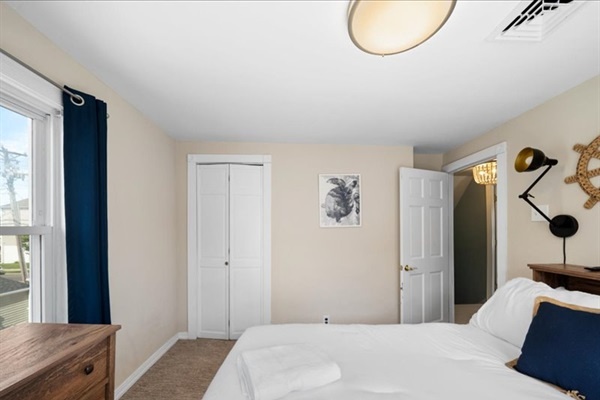 Anchors, rope details, and plush linens create a coastal retreat made for relaxation and quiet mornings.