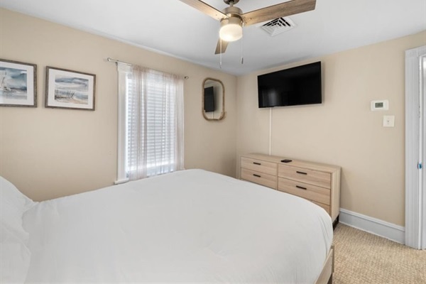 Relax in bed with a favorite show or drift off to the sound of the sea breeze through open windows.