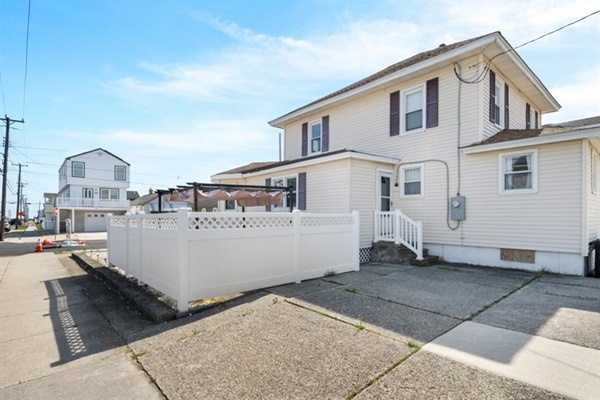 Your beach escape awaits—plenty of parking, fenced privacy, and easy access to the sand and surf.