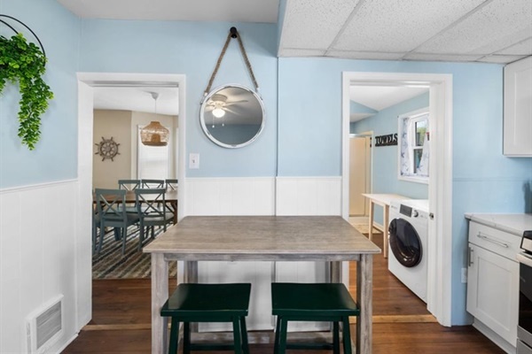 Easy flow from kitchen to bath and laundry—convenient and cozy after sandy beach days.