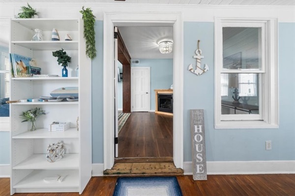 Step inside to breezy coastal style—bright blues, warm wood, and a space that instantly feels like vacation.
