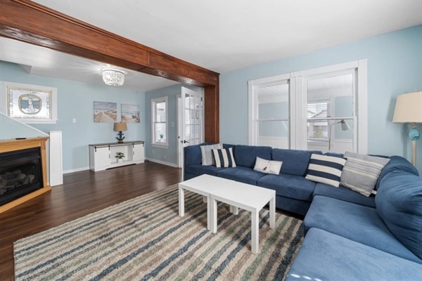 Relax on the spacious sectional after a beach day—stream movies, sip wine, or enjoy the warmth of the fireplace.