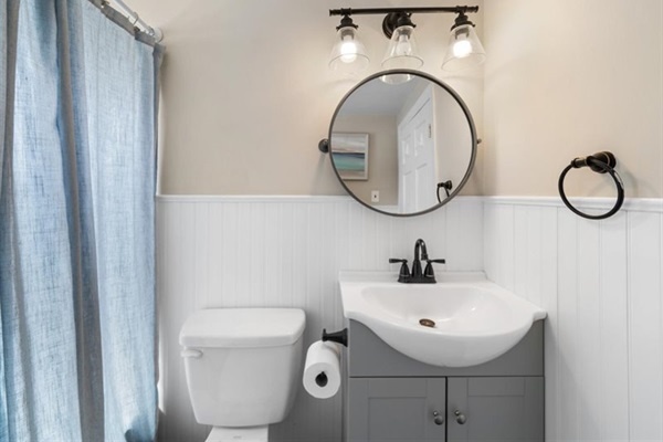 Fresh, beach-inspired bath with modern fixtures and soft lighting—your private refresh spot between adventures.
