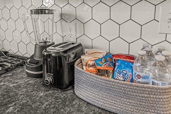 Stay refreshed with complimentary snacks, bottled water, and a fully stocked kitchen ready for any craving.