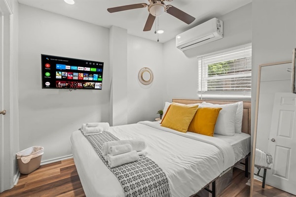 You will love the cozy ambiance of this bedroom! The comfortable bed with plush pillows and fresh linens, combined with the modern TV, creates the perfect space to relax and unwind after a busy day.