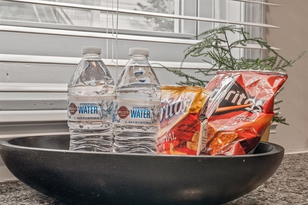 Appreciate the thoughtful amenities, including complimentary bottled water and snacks. This welcoming touch ensures you stay refreshed and satisfied throughout your stay, adding to the comfort of your visit.