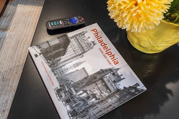 Immerse yourself in the local culture with a touch of Philadelphia history! This charming coffee table setup, featuring a Philadelphia-themed book and fresh flowers, will make your mornings extra special.