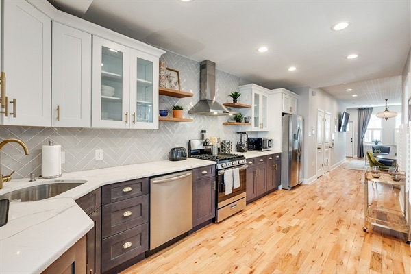 Seamless flow from kitchen to living room makes entertaining effortless and every meal feel special.