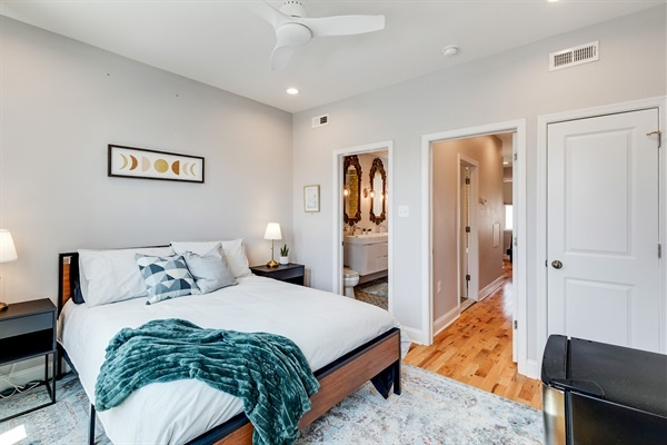 Your private retreat awaits—relax in a queen bed with soft linens and an en suite bath just steps away.