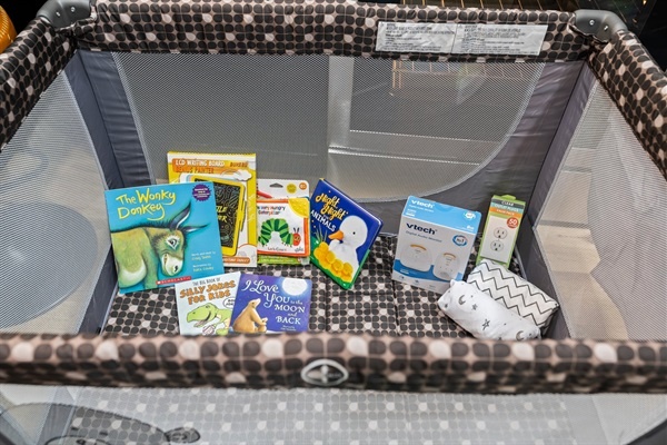 Storytime and smiles await — stocked with books and baby essentials to make your stay feel like home.