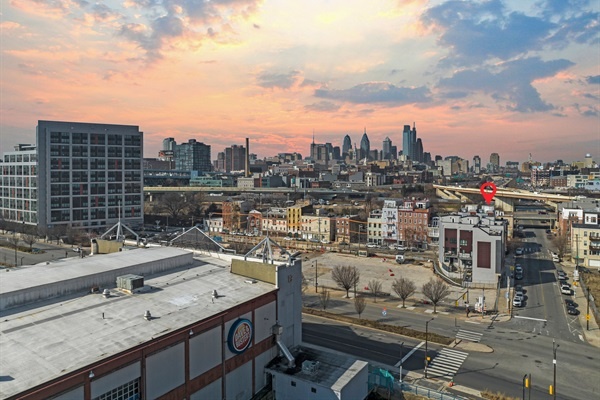 A great view of your stay from the air with the city skyline in the background!