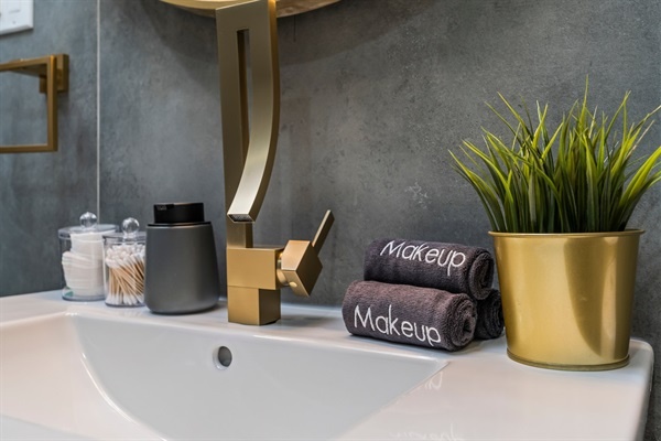 Modern glam meets everyday comfort — soft towels, gold accents, and everything you need to feel pampered.