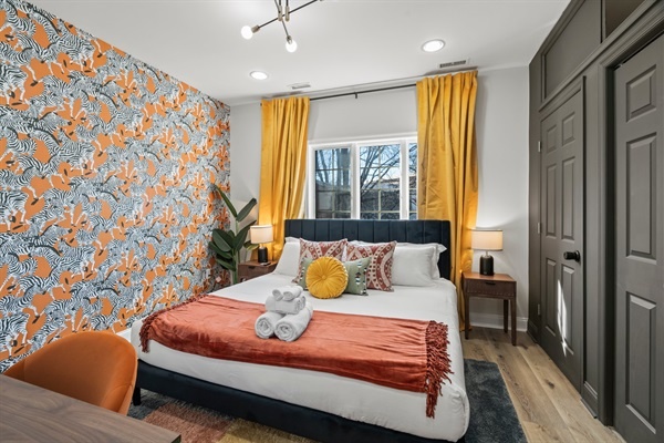 Bright, playful, and full of personality — unwind in this vibrant bedroom that mixes bold design with ultimate comfort.