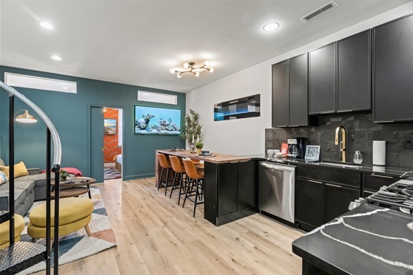 A seamless flow from kitchen to lounge — bold colors and open design make this home as stylish as it is comfortable.