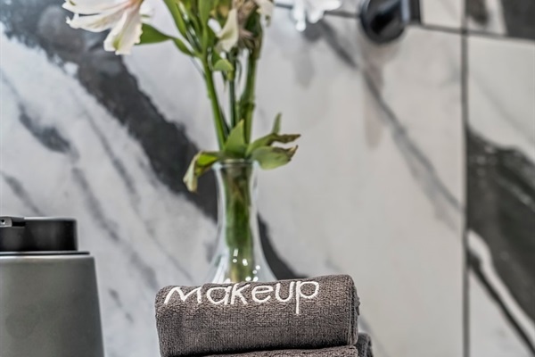 Get ready with ease—this bright vanity setup and luxe details make your morning routine feel effortless.