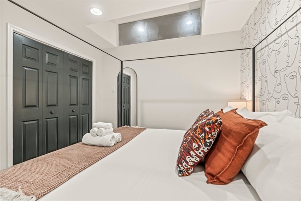 Wake up refreshed in this stylish suite featuring plush bedding, warm tones, and thoughtful modern touches.