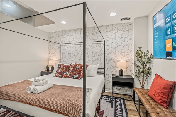 End each night in boutique comfort—stretch out beneath soft sheets and stream your favorite show before bed.