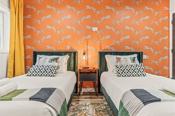 Wake up energized in this playful twin room—vibrant design meets cozy comfort for guests of any age.