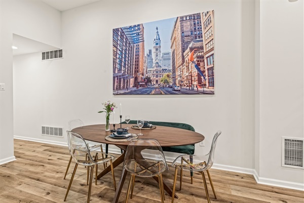 Enjoy shared meals and conversation beneath a striking Philly cityscape—modern dining meets hometown charm.