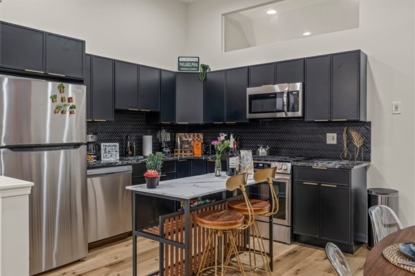 Sleek chef’s kitchen featuring quartz-style counters, full stainless suite, and everything you need to cook, sip, and unwind.
