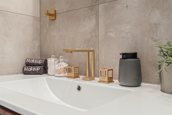 Luxury in the details—soft towels, golden finishes, and thoughtful touches that make you feel pampered.