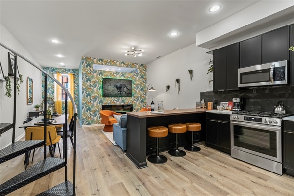 The heart of the home, where conversation flows from the kitchen to the living room.