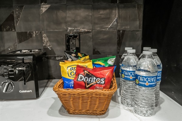 Late-night cravings? We’ve got you covered. Enjoy complimentary snacks and water during your stay.