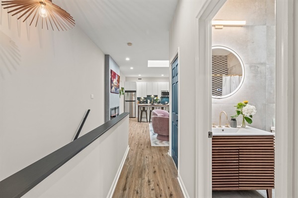 Your hallway near the bathroom leading to the living area and kitchen.l