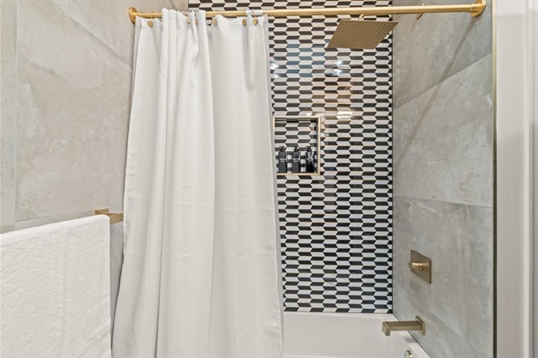 Enjoy the spa like experience in rainfall shower with designer marble tile