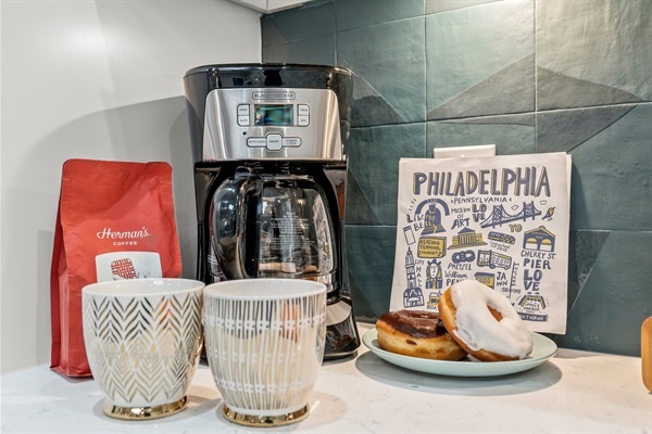 Savor your morning coffee in a chic kitchen equipped with modern conveniences and thoughtfully selected items to make you feel right at home.