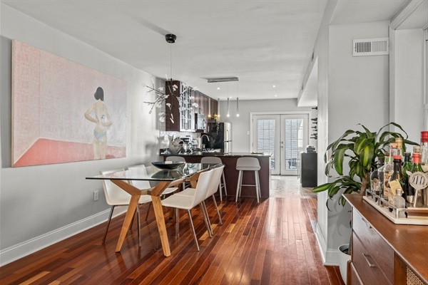 The sleek dining area seamlessly connects to the kitchen, making it perfect for entertaining.
