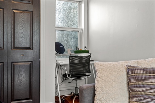 A compact home office setup with a desk and chair, ideal for remote work or study sessions.