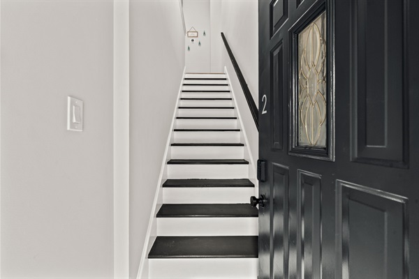 Step inside your private city retreat — a bright, welcoming entrance leading to comfort and style upstairs.