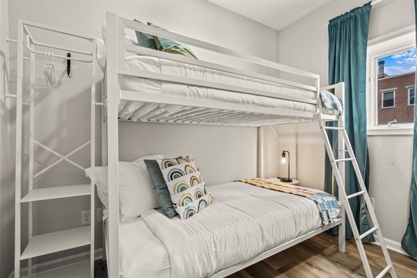 Soft linens and a bright atmosphere make this bunk room a restful hideaway for kids or extra guests.