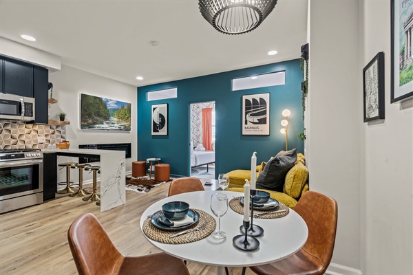 Enjoy meals or morning coffee in this bright, artful space that flows seamlessly from kitchen to lounge.