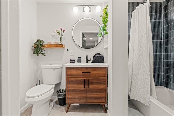 Step into a sleek rainfall shower surrounded by artisan tile—relax and let the day melt away.