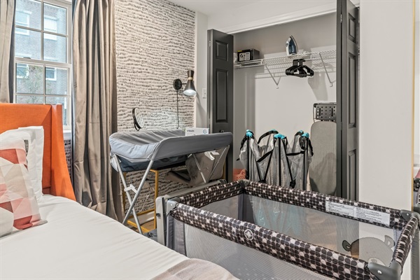 Designed with families in mind — a welcoming space complete with crib, changing table, and thoughtful touches.