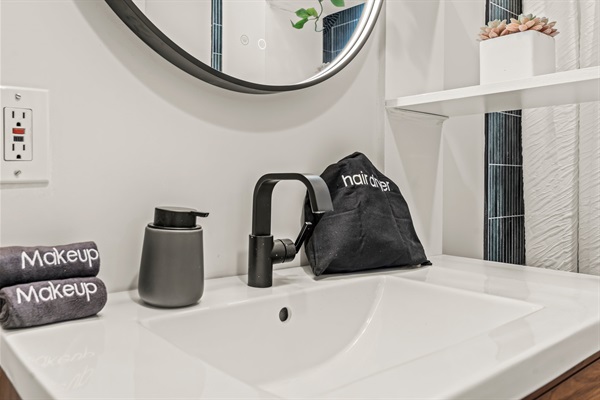Little luxuries included—makeup towels, hair dryer, and modern fixtures designed with comfort in mind.