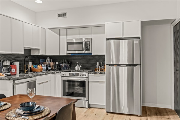Cook your own meals at home with family and friends in your designer kitchen!